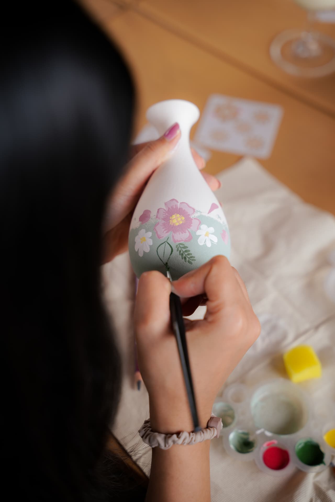 Floral design hand-painted on a ceramic vase