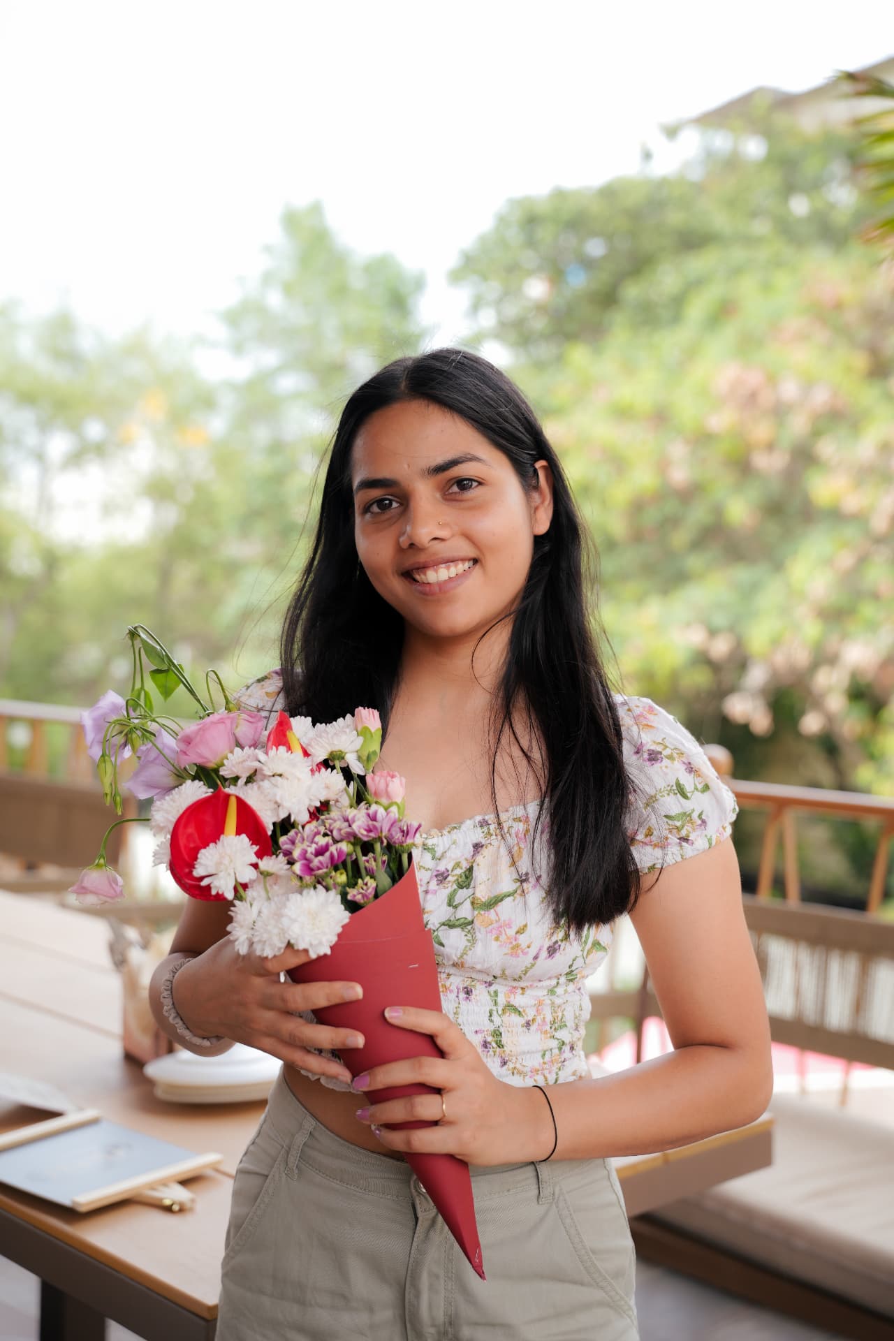 Participant with a bouquet after the session